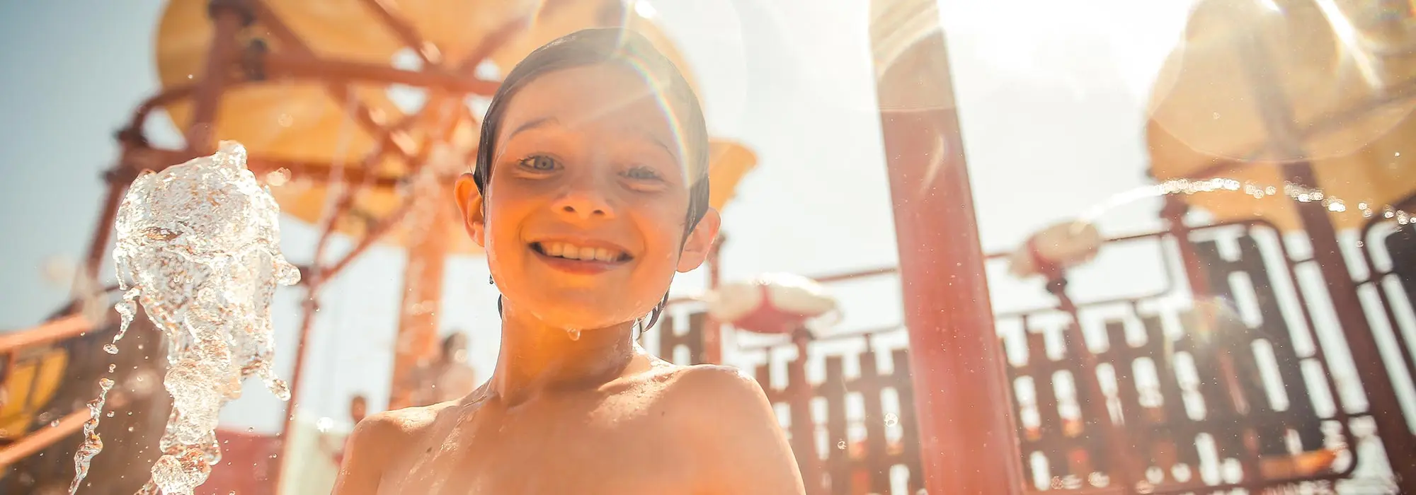 Water park attraction with multiple slides