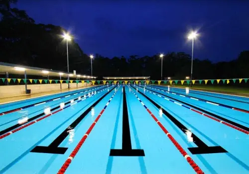 Night view of 50 metre Olympic swimming pool