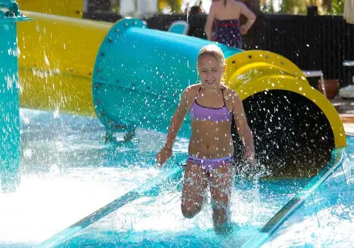 Girl enjoying Paloma waterslide runout area